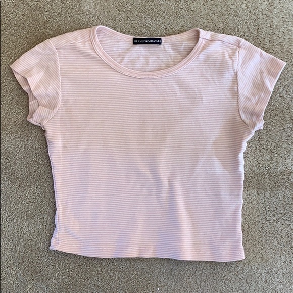 Brandy Melville Tops - Rare brandy Melville pink and white t shirt